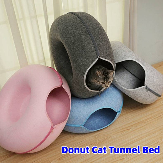 Wool felt donut cat tunnel bed with a cat curled inside
